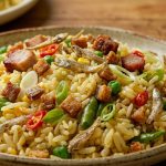 nasi goreng ikan asin jambal roti dengan aroma khas dan taburan bawang goreng