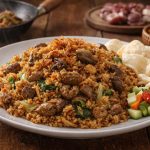 nasi goreng jeroan sapi pedas dengan ati ampela dan taburan bawang goreng